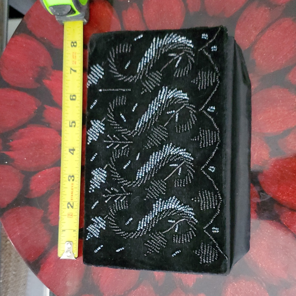 Black wallet with front decorative design